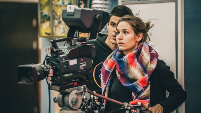 Film students using camera equipment