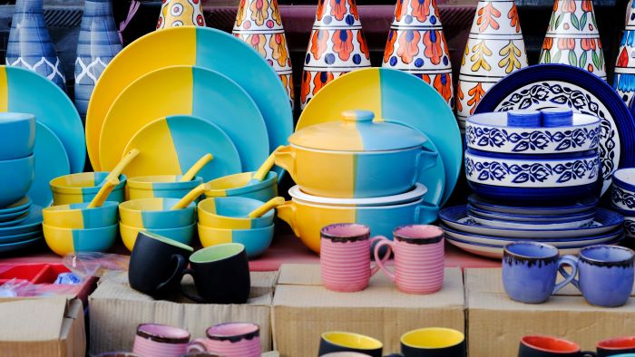 Ceramic dishware on a market stall