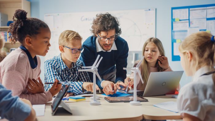 Science teacher with school children