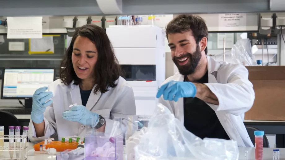Two PhD students working in a laboratory