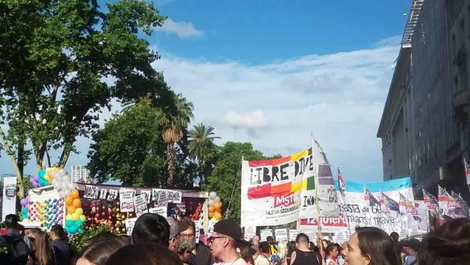 A crowd with protest banners and signs