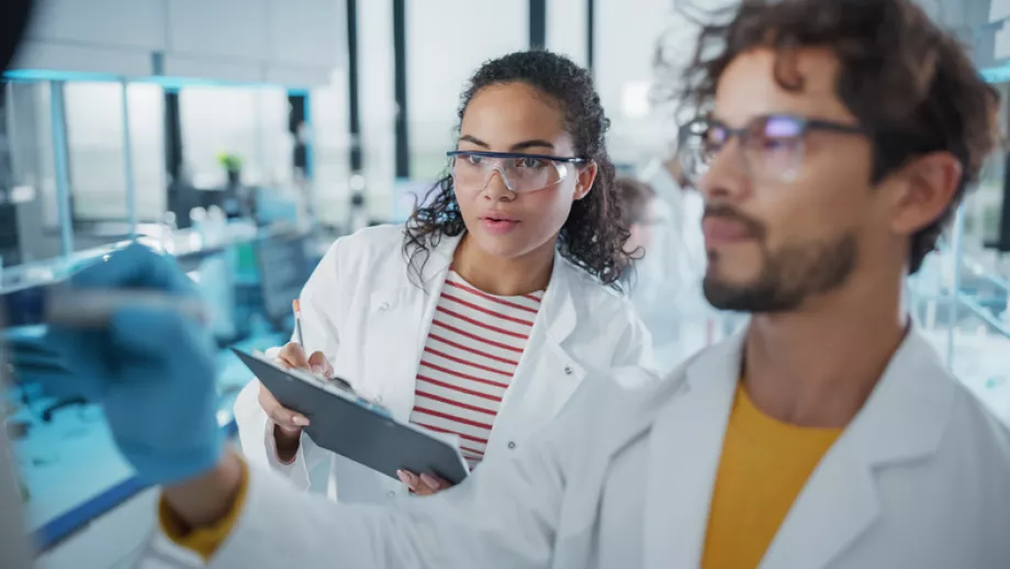 A man and woman wearing lab coats